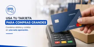 Cartão de débito e crédito na mão sobre terminal de pagamento